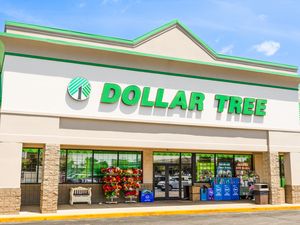 Dollar Tree storefront with entrance and signage visible some items on display outside near the entrance