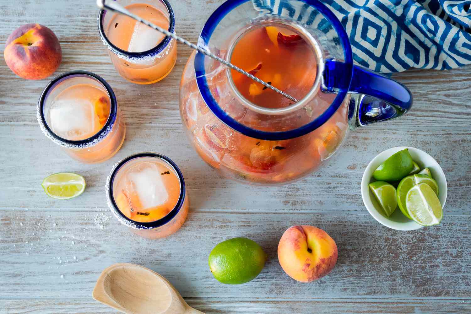 Overhead view of peach margaritas made with grilled peaches.