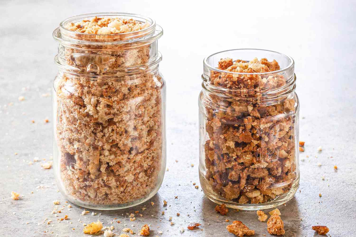 How to Toast Breadcrumbs in the Oven - two jars filled with toasted breadcrumbs