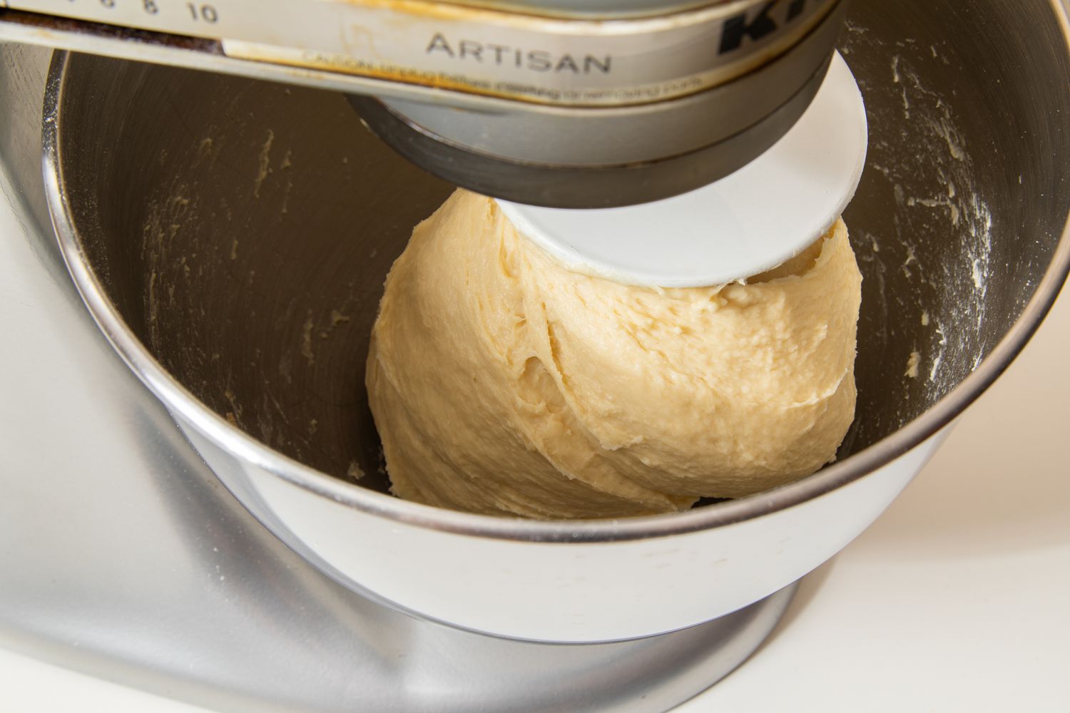 Salted honey roll doughball on the dough hook in a stand mixer