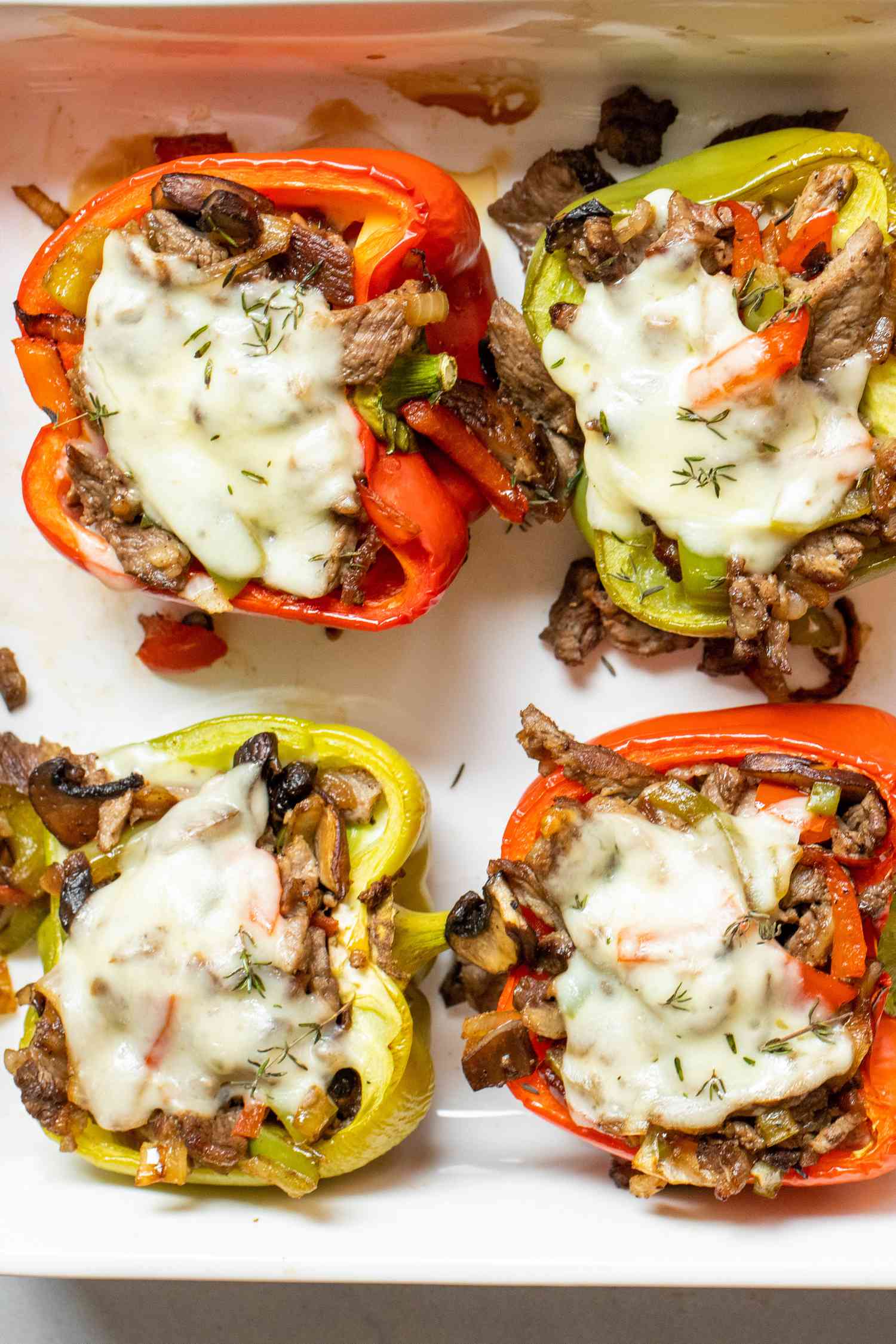 Cajun stuffed bell peppers in a baking dish