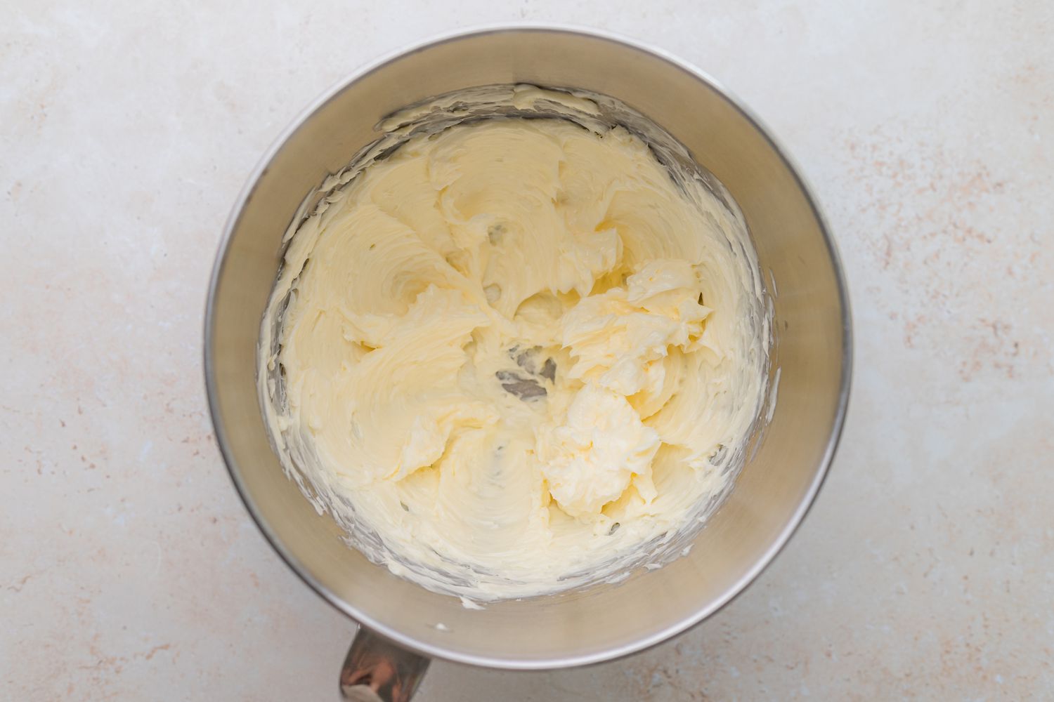 Buttercream in Mixer Bowl for Rainbow Layer Cake