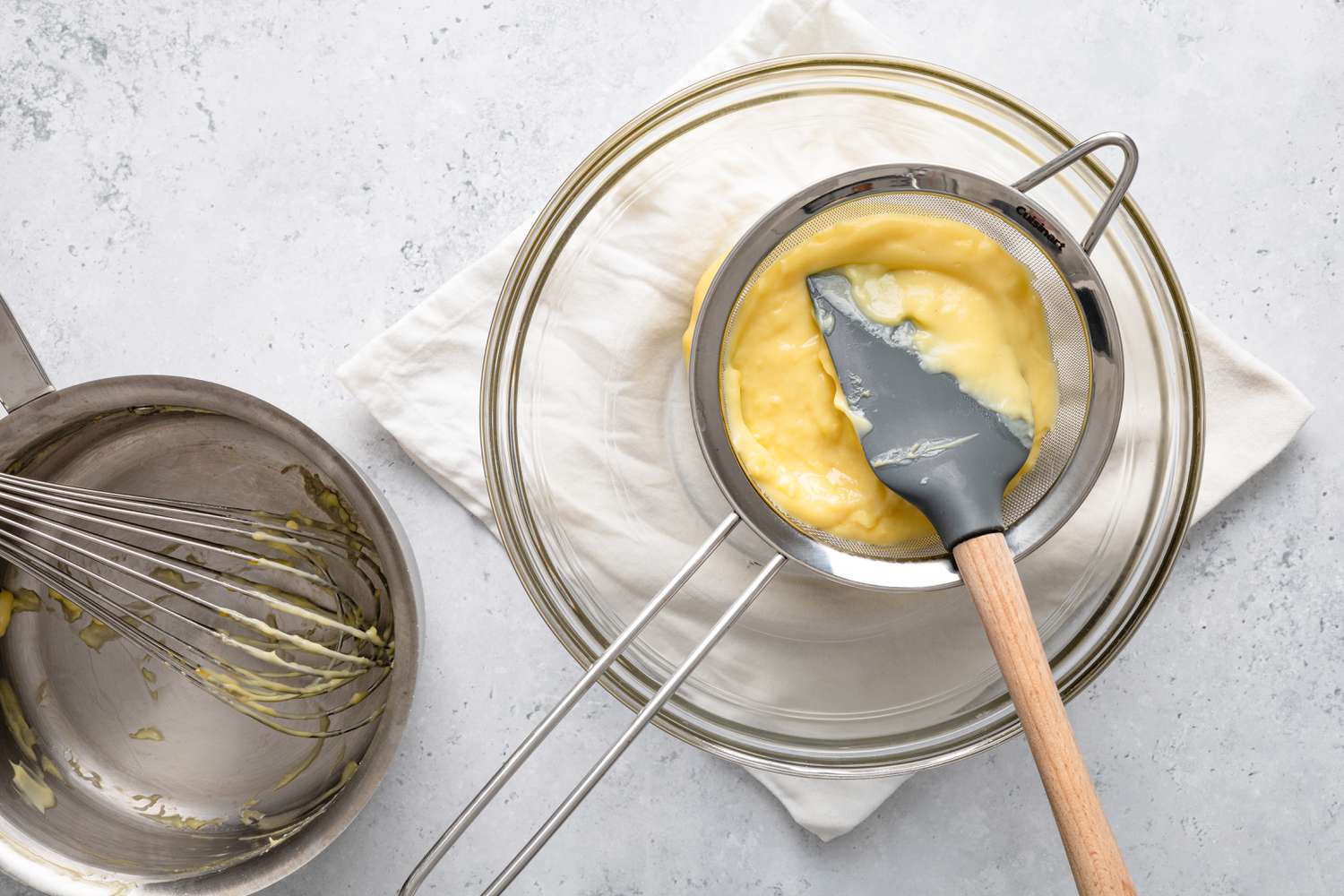 Pastry Cream in a Sieve over a Bowl for Bee Sting Cake