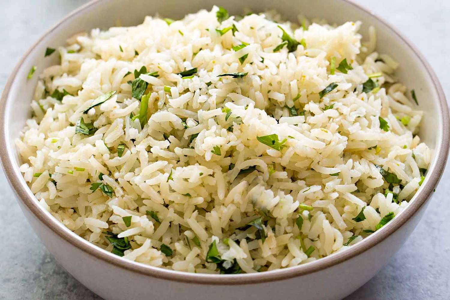 A bowl of cilantro lime rice served in a white dish