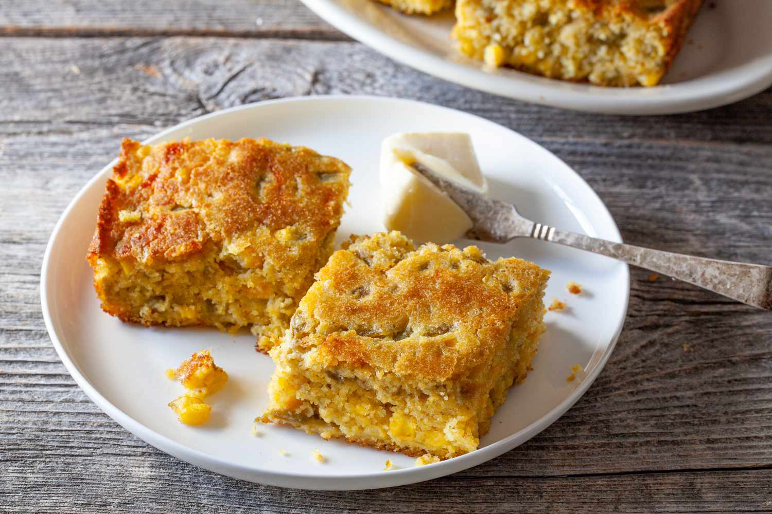 Green Chile Corn Bread on Plate with Butter and Butter Knife