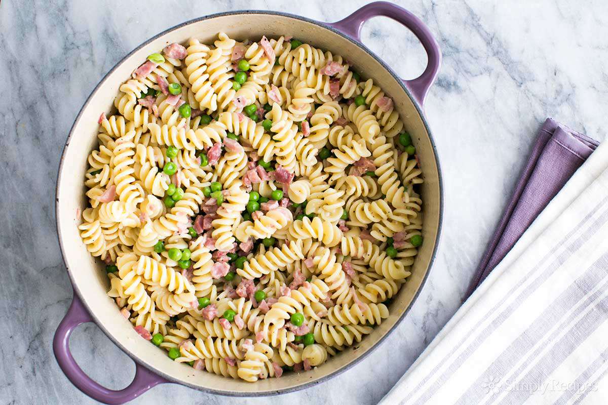 pasta with peas and ham in a dutch oven