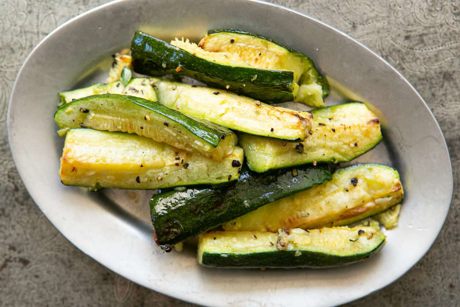 A plate with roasted zucchini on it
