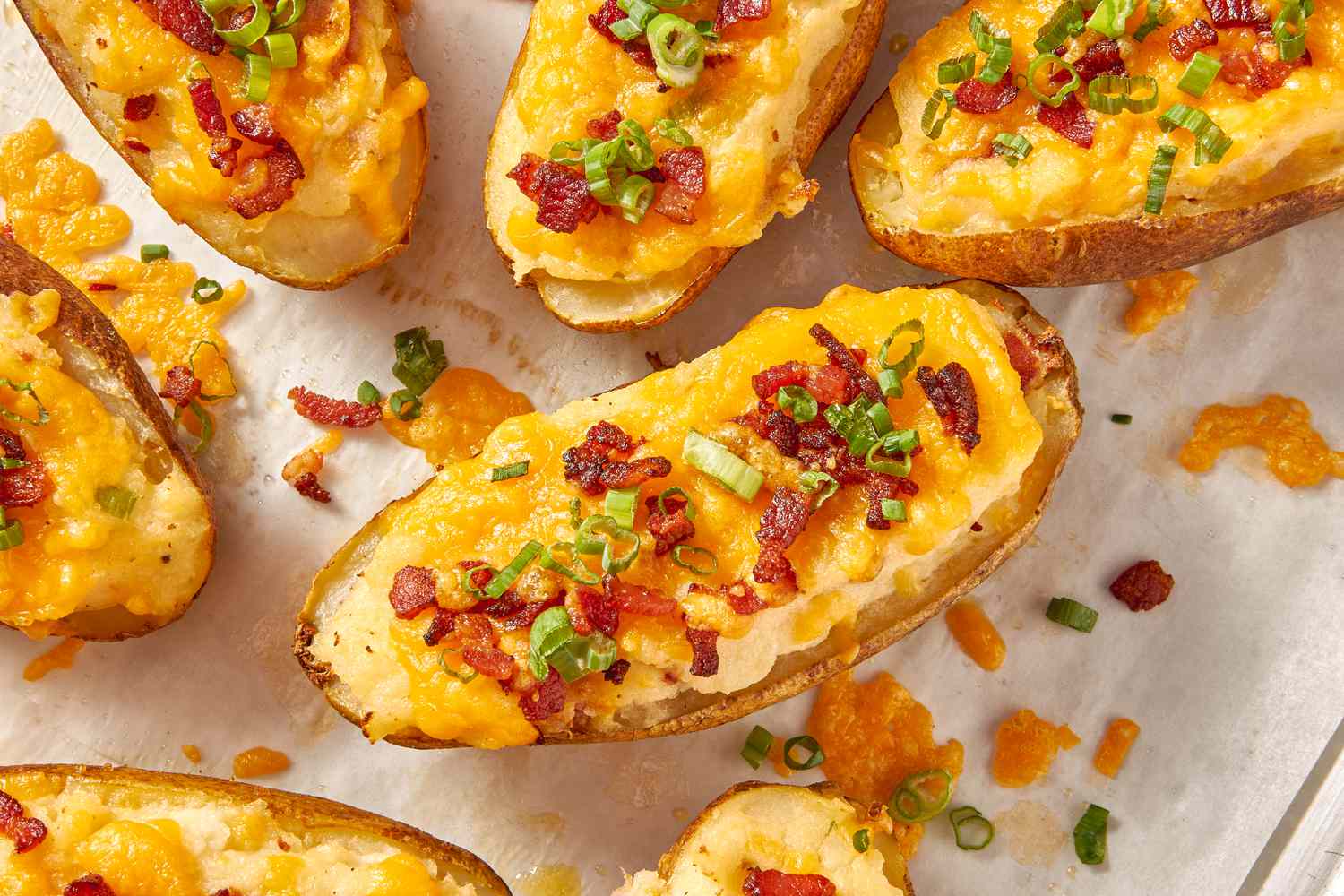 Twice baked potatoes on a piece of parchment paper