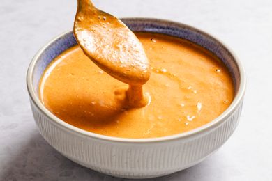 A bowl of Mississippi comeback sauce with a spoon dipping into it