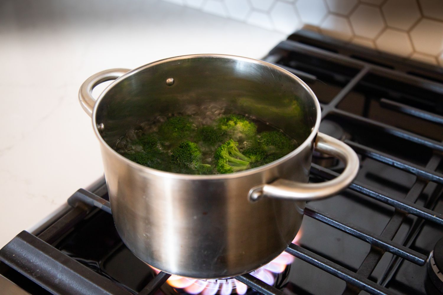 Broccoli Boiling in Pot of Boiling Water over the Stove for How to Blanch Broccoli