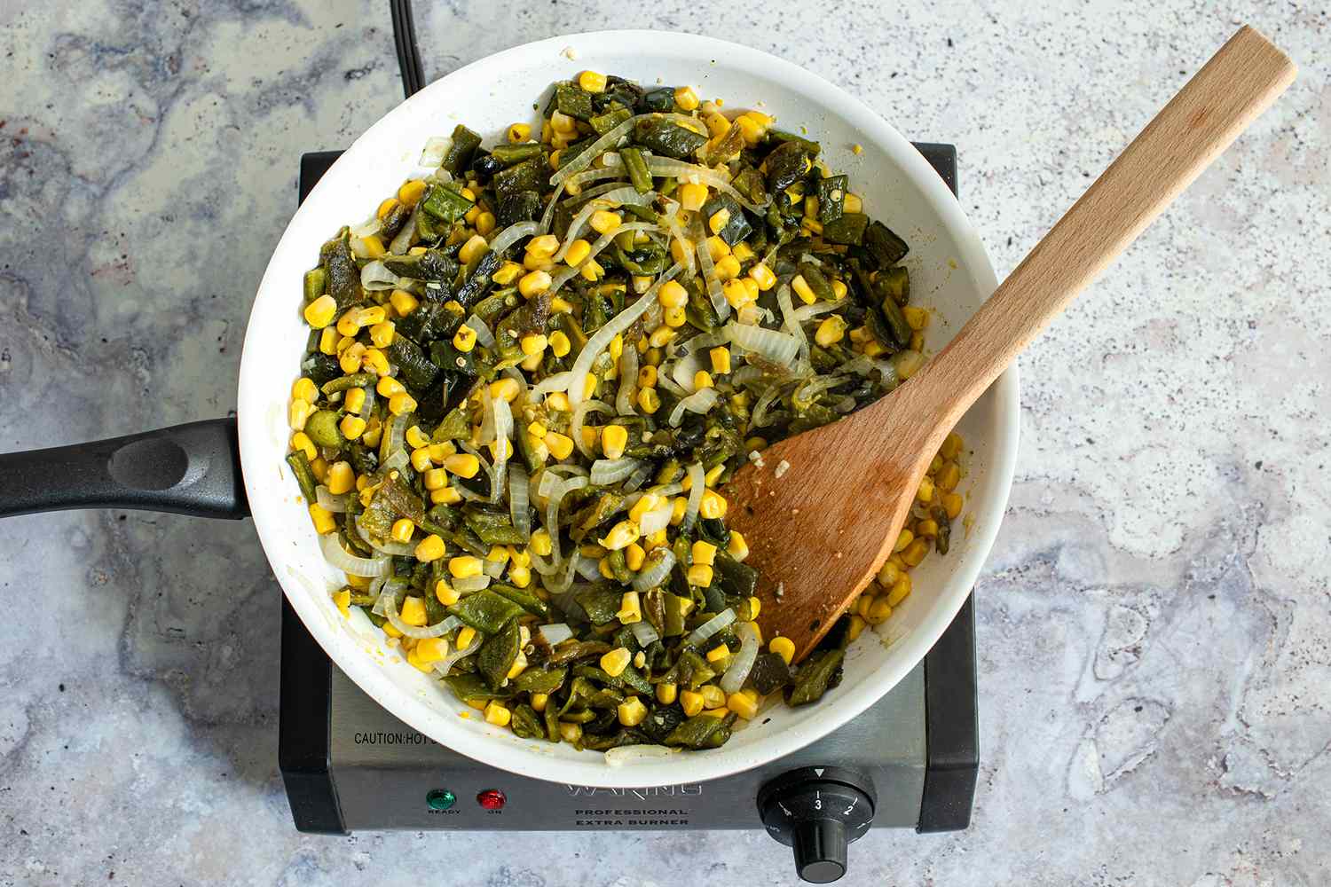 Peppers Added to Skillet with Corn and Onions 