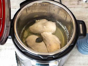Three cooked chicken breasts in the instant pot