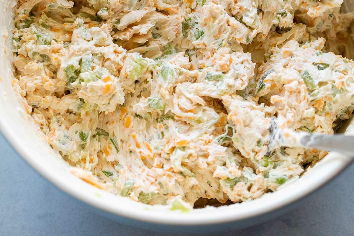 Ingredients mixed in a bowl for a cheese ball recipe.