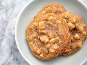 White Chocolate Macadamia Nut Cookies Bird's Eye View of White Chocolate Macadamia Nut Cookies on white plate