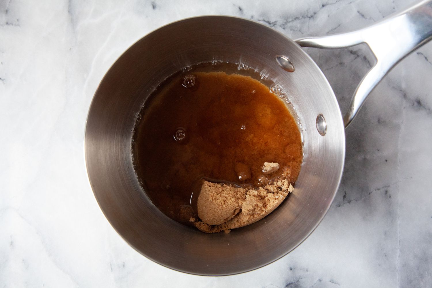Brown Sugar and Water Boiling in a Sauce Pan for Bubble Tea Recipe