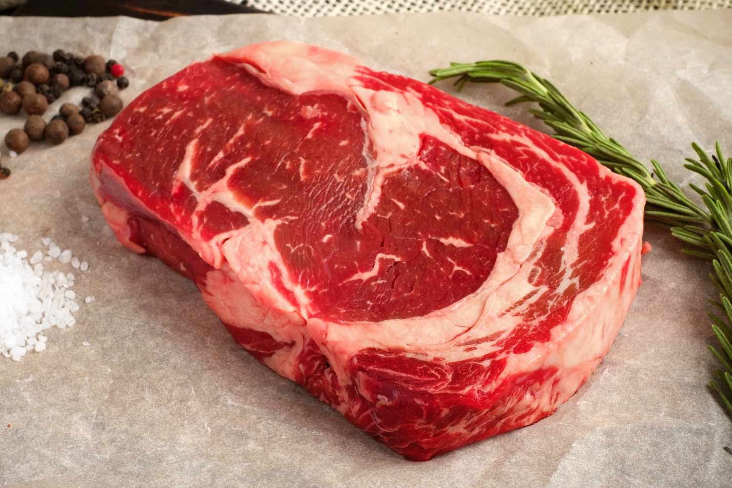A raw ribeye steak