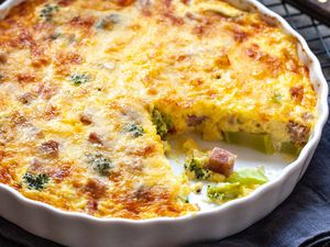 Crustless Quiche with Ham - close up of ham and broccoli quiche in a white dish