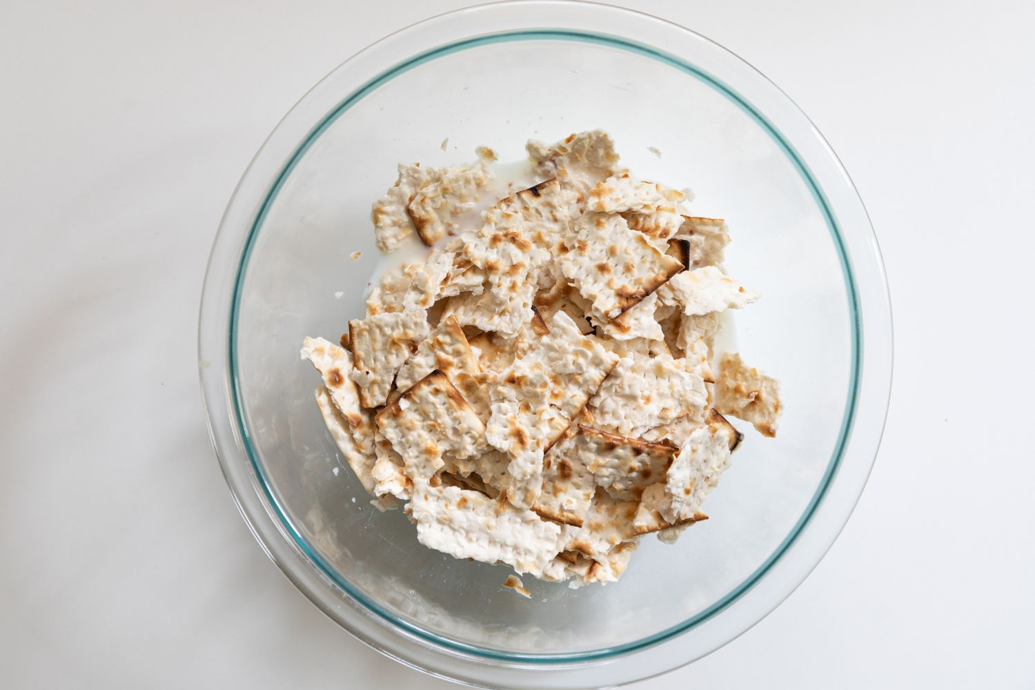 Crackers in a bowl to make matzah brei.