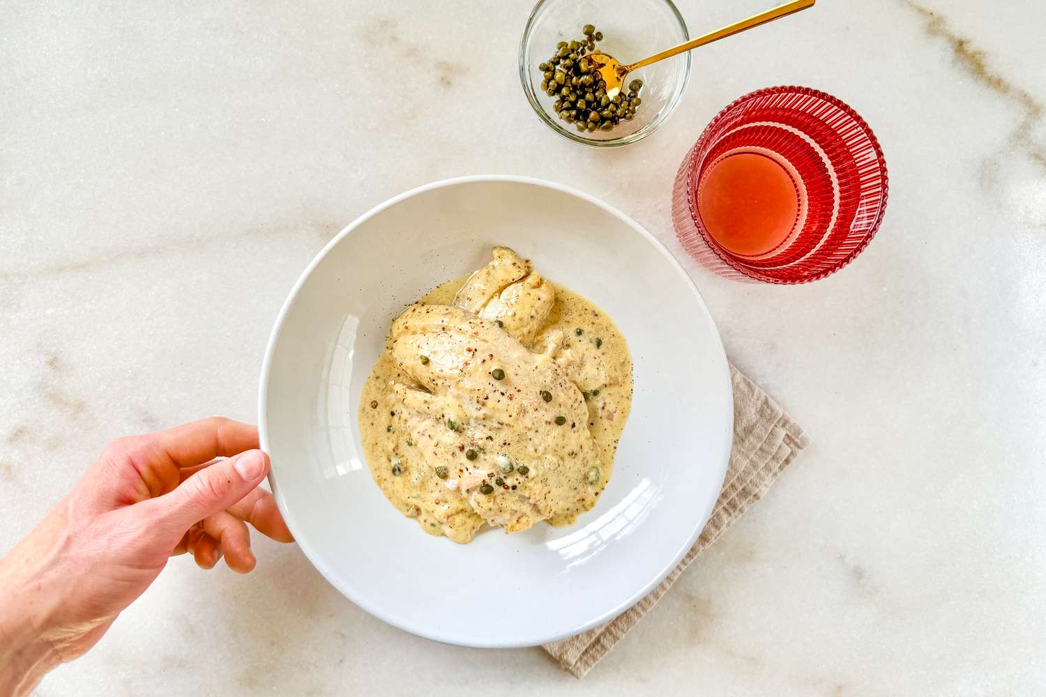 Overhead shot of a plate with Ina Garten's mustard roasted fish recipe