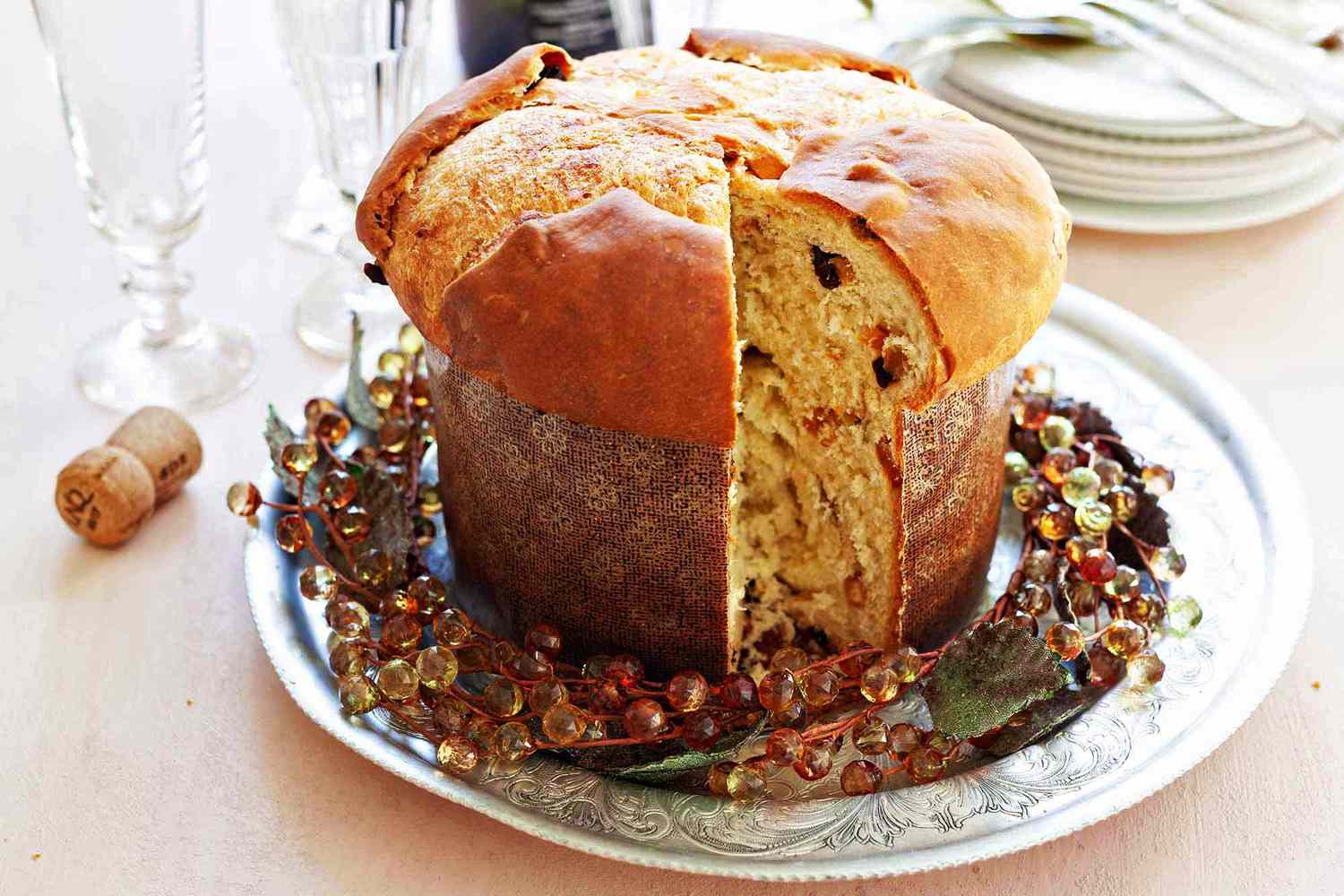 A round loaf of panettone with a slice removed