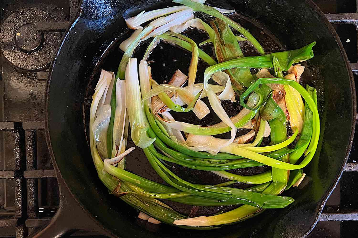 Skillet scallions cooking in a pan