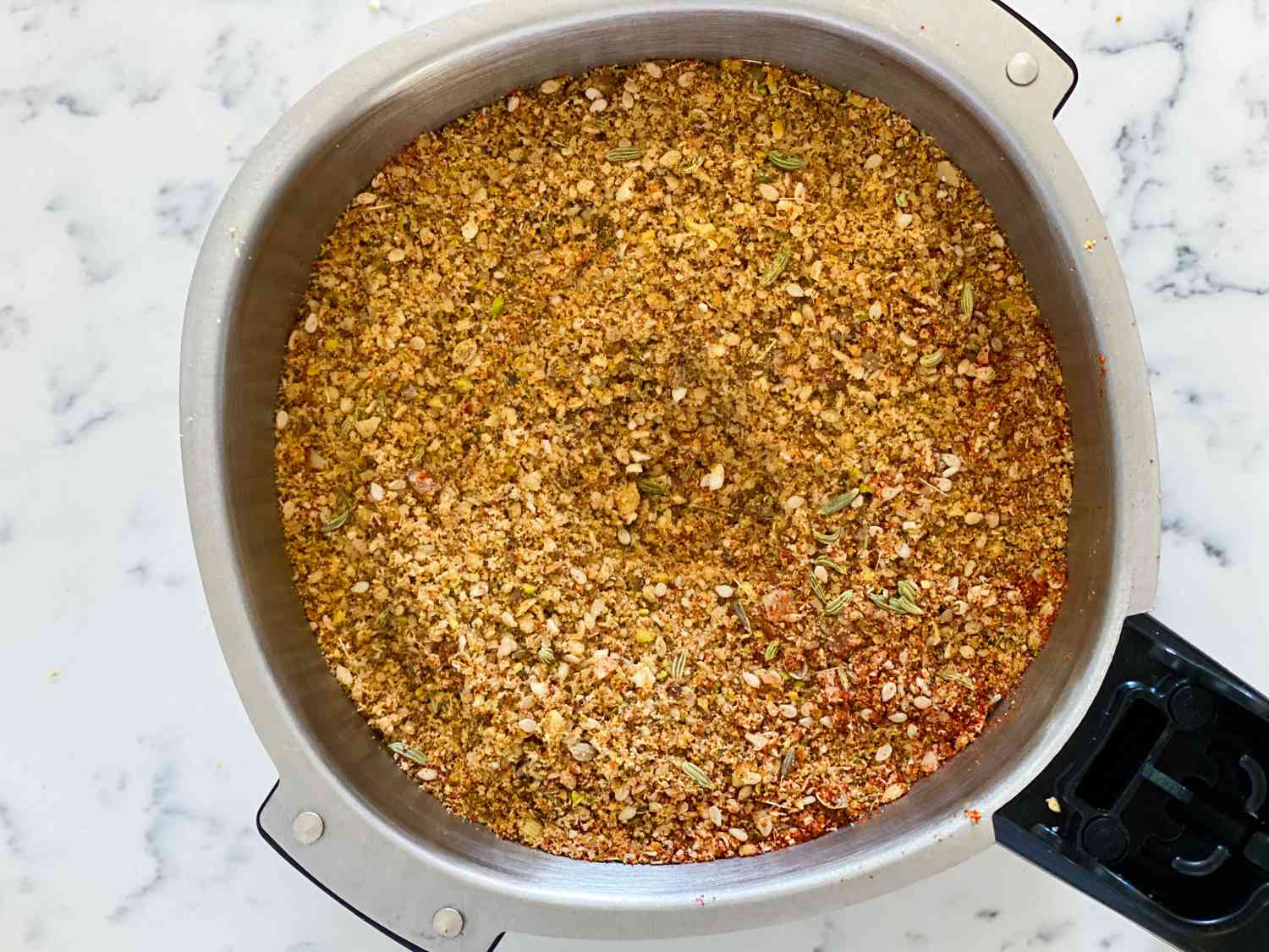 Dukkah spice ground in a spice grinder.