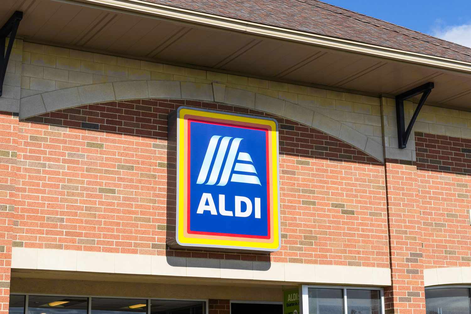 Aldi sign and logo over the main entrance to an Aldi store