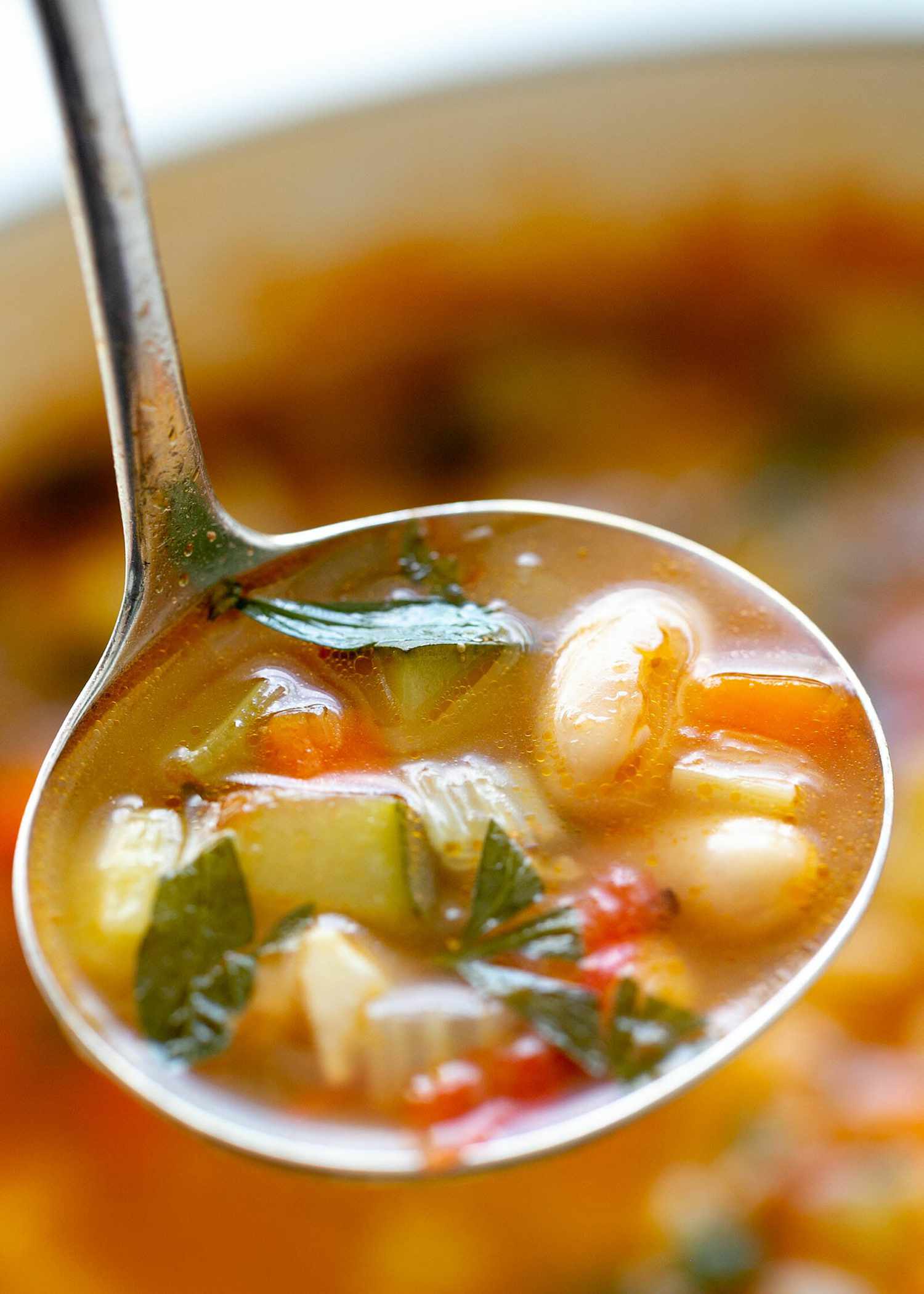 minestrone soup in ladle