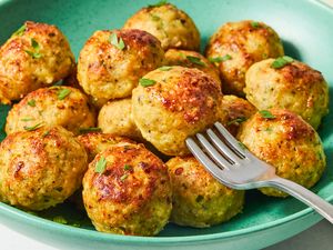 Chicken meatballs served on a plate with a fork