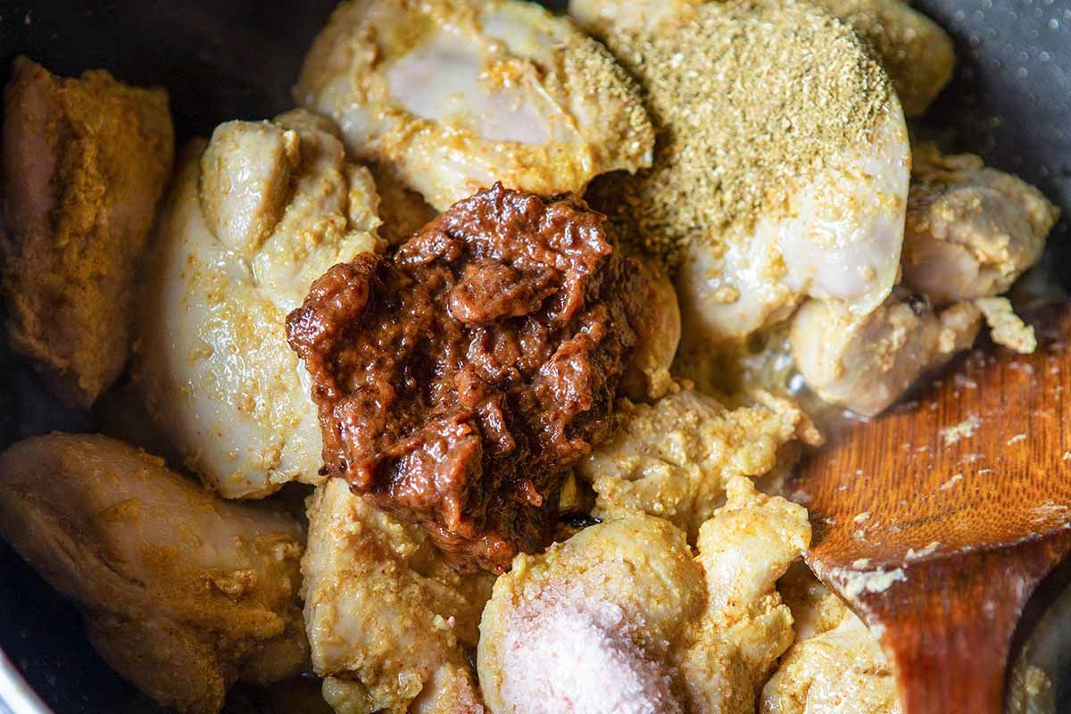 Authentic Chicken Korma Recipe - chicken with sauce, onion paste in pan