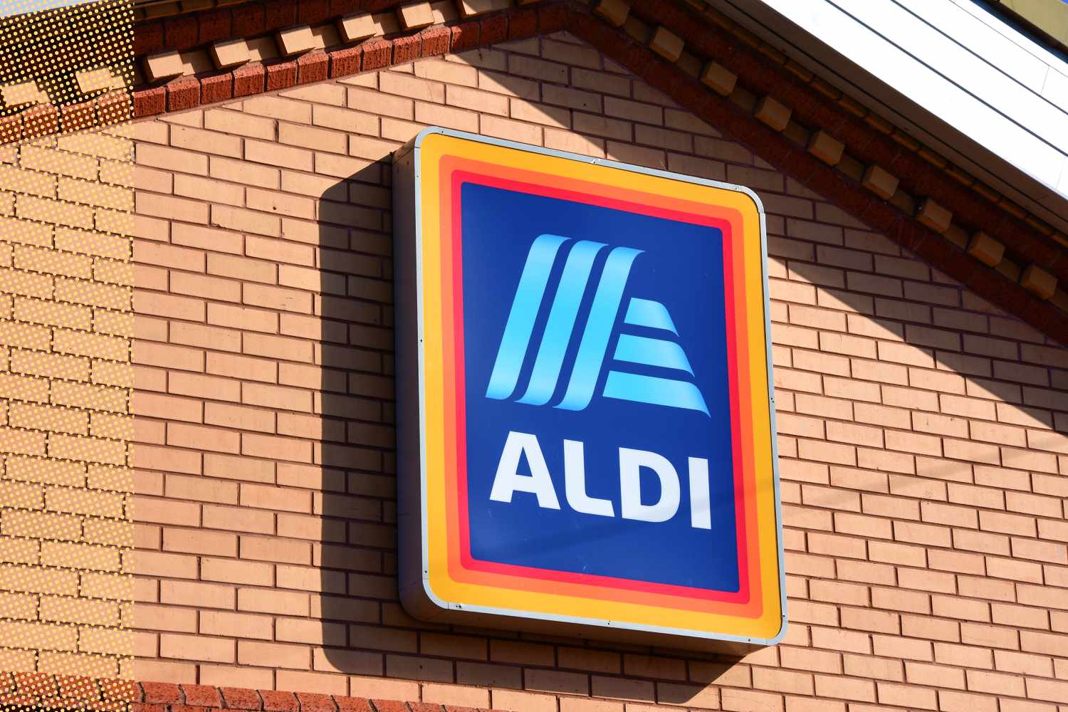 ALDI logo on a brick wall