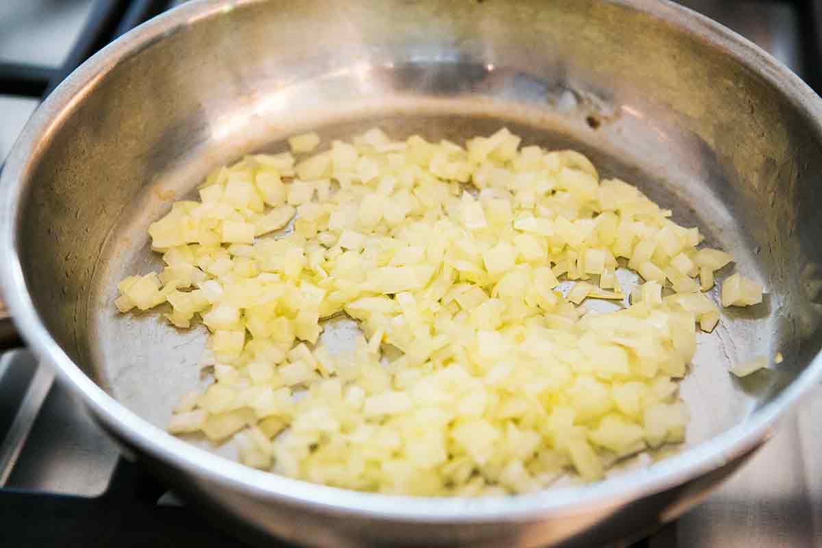 sautéing onion and curry for coconut shrimp curry recipe