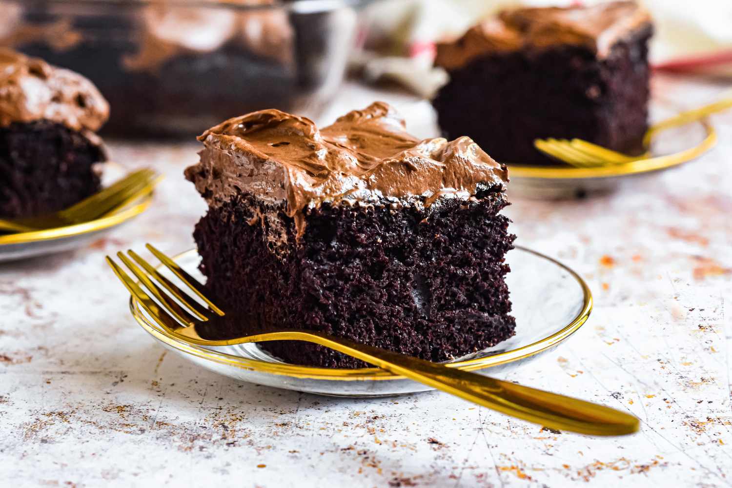 Slice of Chocolate Mayonnaise Sheet Cake on a Plate with a Fork