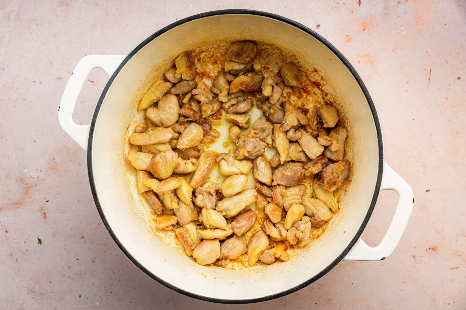 Chicken Cooked in a Dutch Oven after Cooked Broccoli Is Removed for Chicken and Broccoli Pasta Recipe