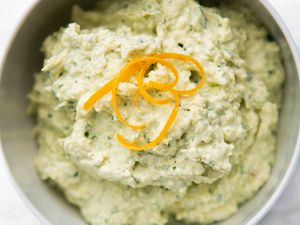 Bowl of Artichoke Lemon Dip Topped With Lemon Zest