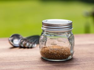 Hamburger Seasoning outside in a glass jar.