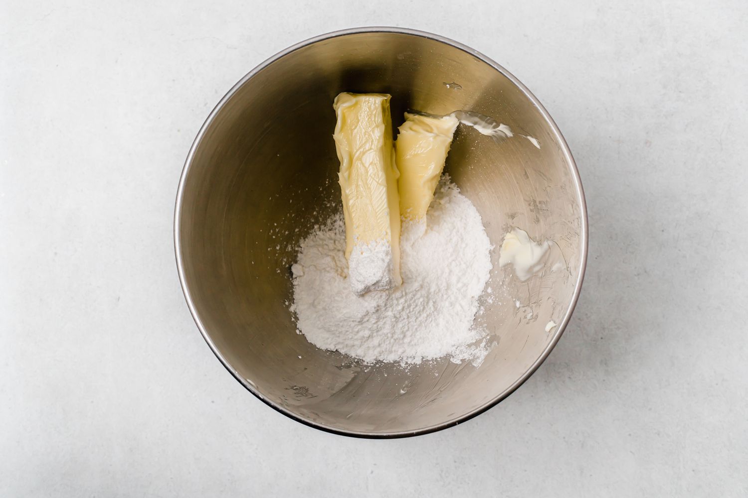 Butter and sugar in a bowl to make shortbread dipped in chocolate and peppermint 