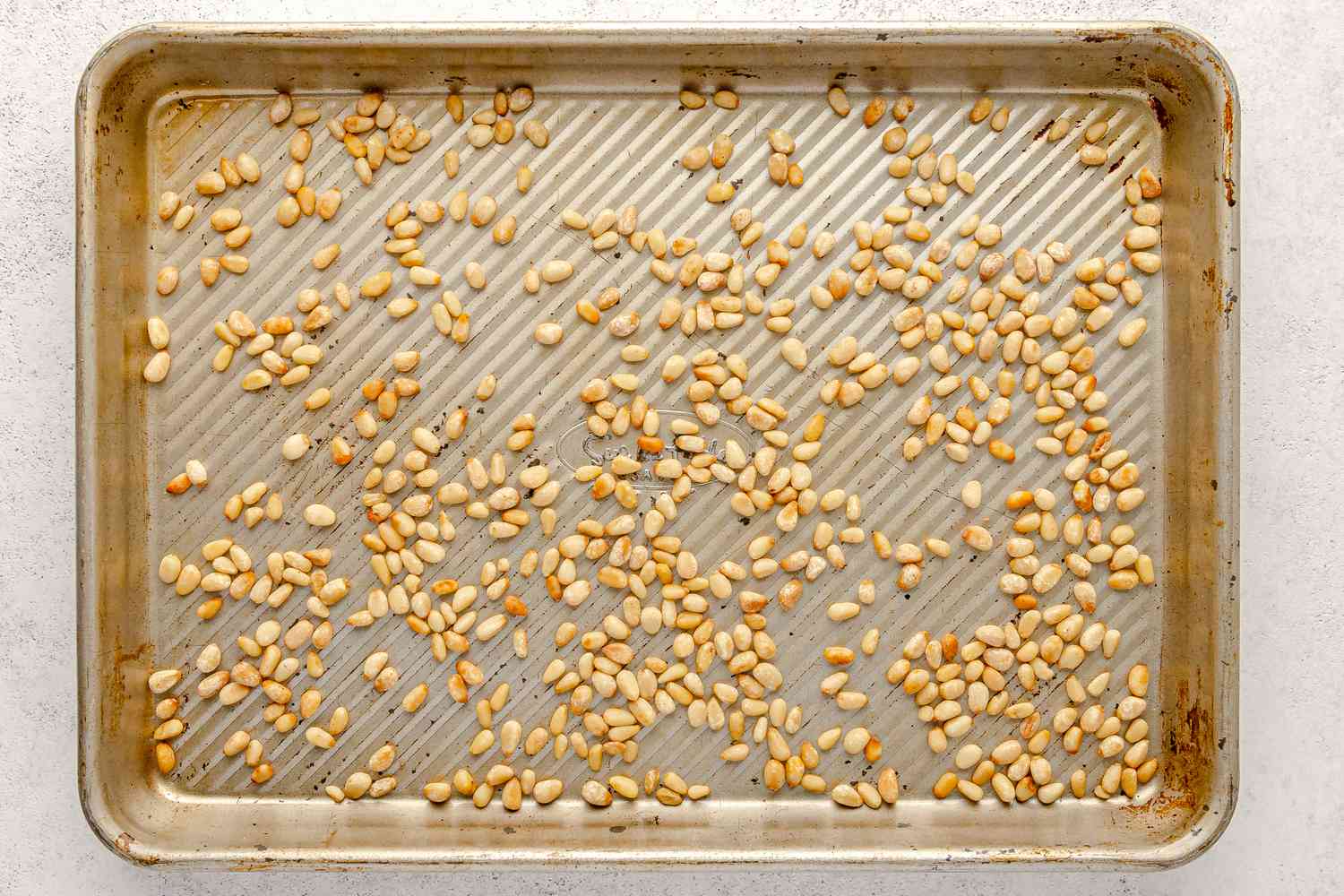 Toasted Pine Nuts on a Baking Sheet