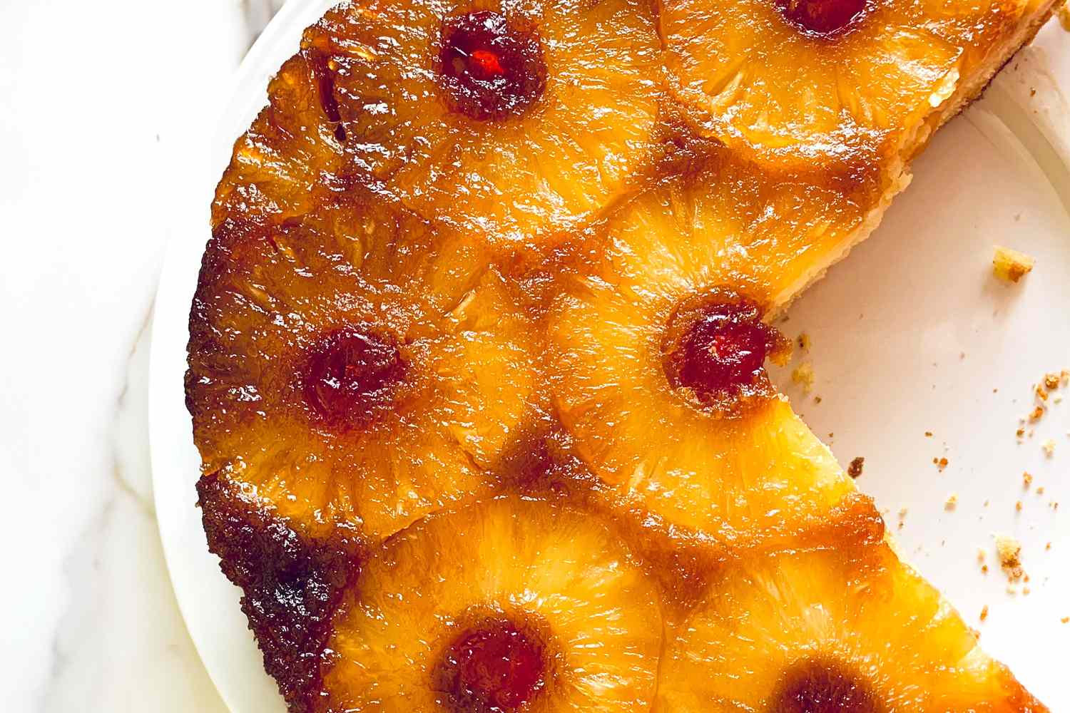 Pineapple upsidedown cake with pineapple slices and cherries