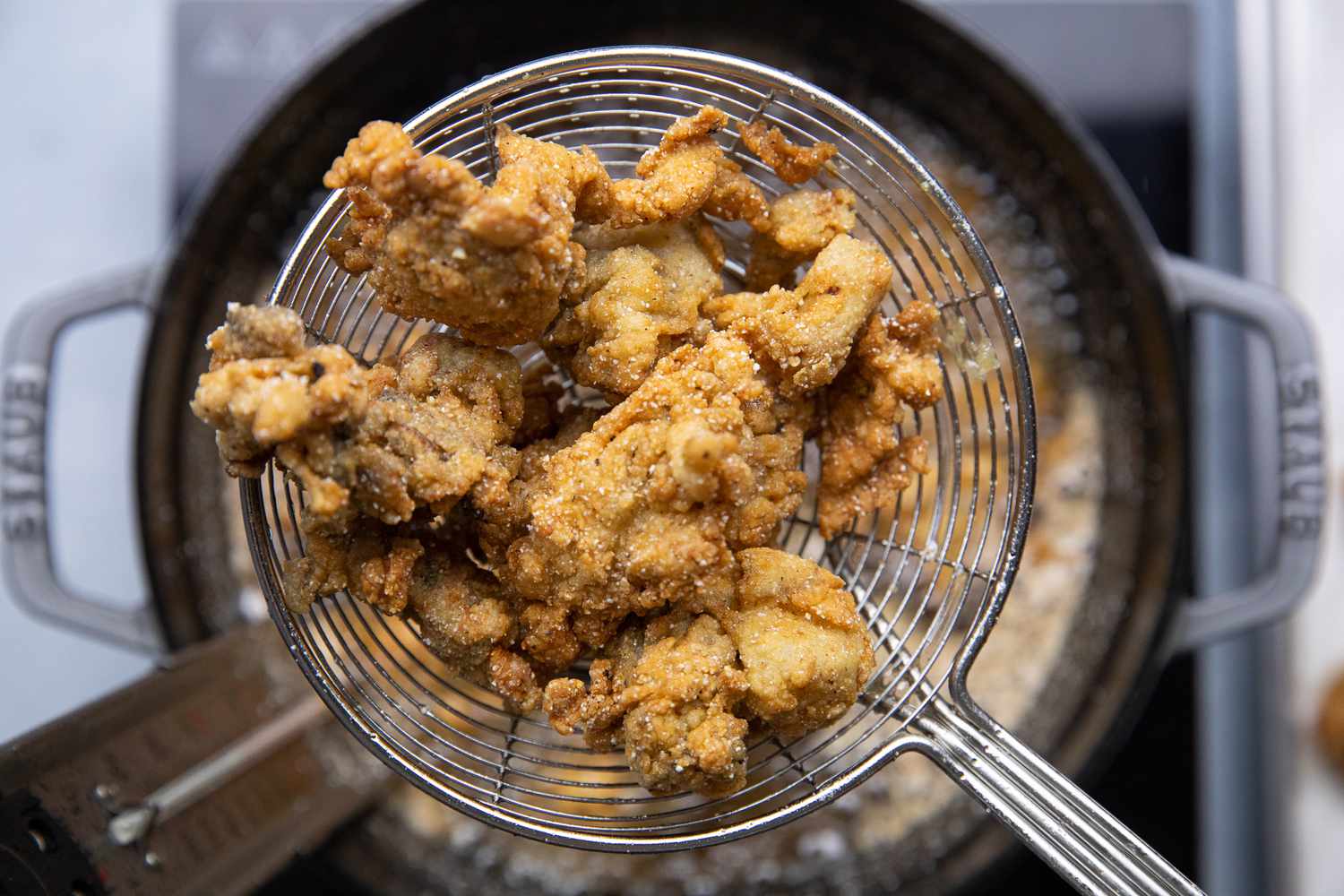 Fried Oysters Removed Using a Spider for NOLA Oyster Po Boy Recipe 