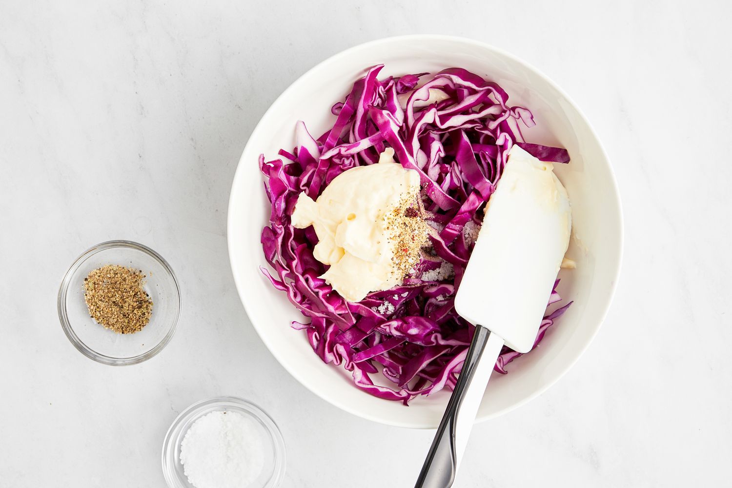 Bowl of Sliced Red Cabbage and Mayonnaise Next to a Small Bowl of Seasoning and Another Small Bowl of Salt for Blackened Shrimp Tacos