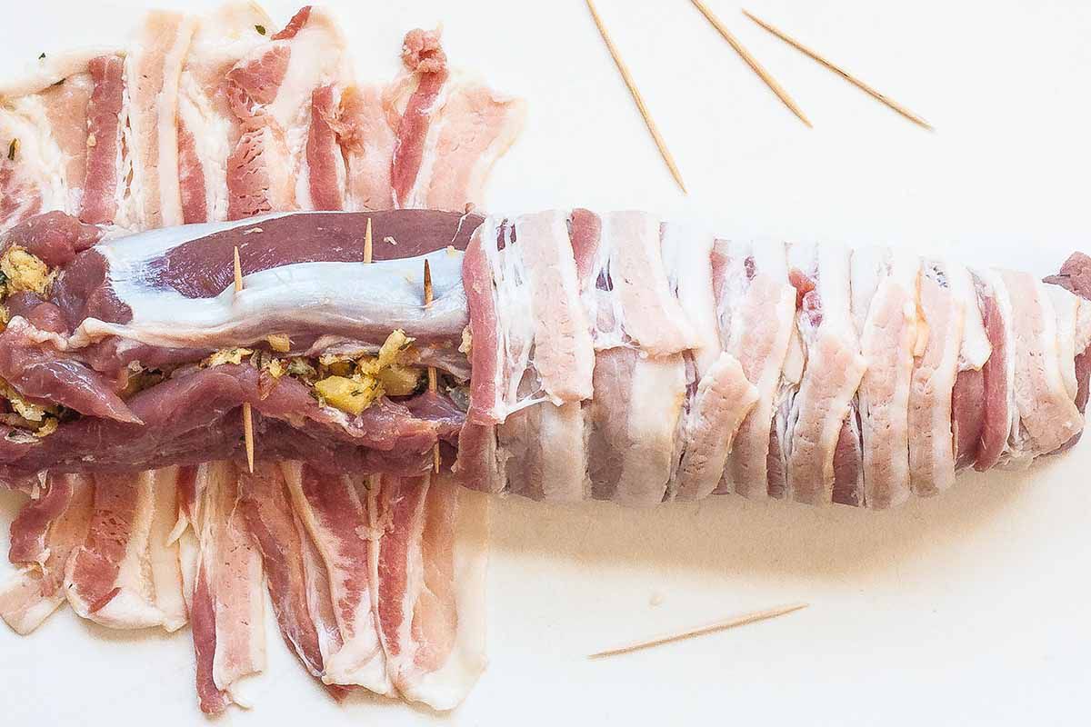preparing a bacon wrapped tenderloin