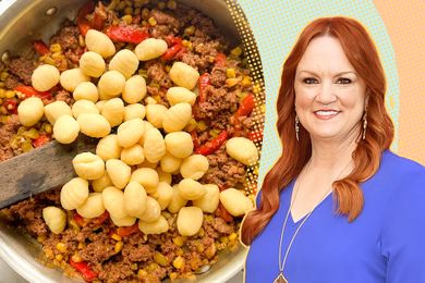Ree Drummond next to a pan of gnocchi being prepared with ground meat and vegetables