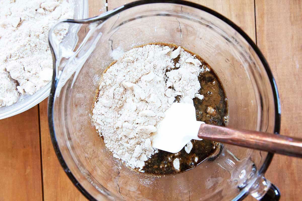 Shoo fly pie filling being made in a glass measuring cup.