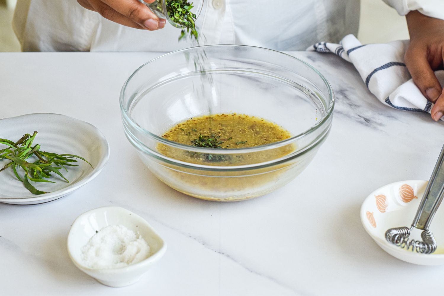 Tarragon-Mustard Vinaigrette: Tarragon Added to a Bowl of Vinaigrette Ingredients