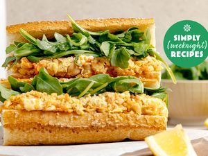 A closeup of a sandwich with lettuce and filling part of a Simply Recipes promotion