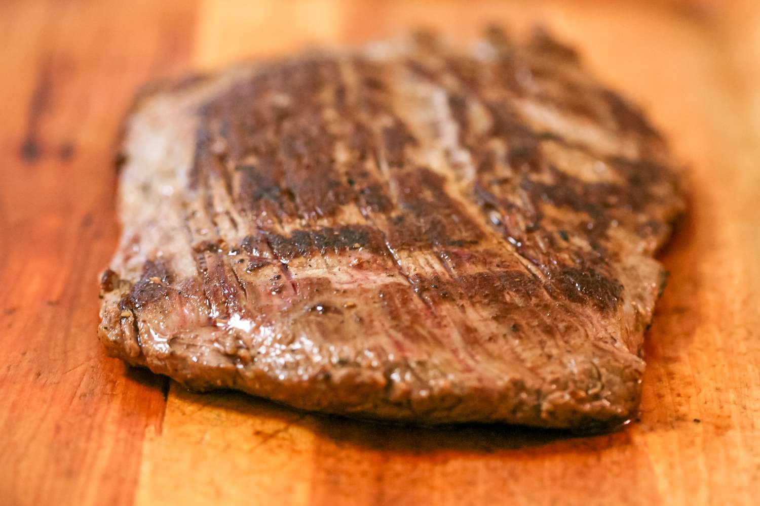 Resting flank steak on a cutting board.