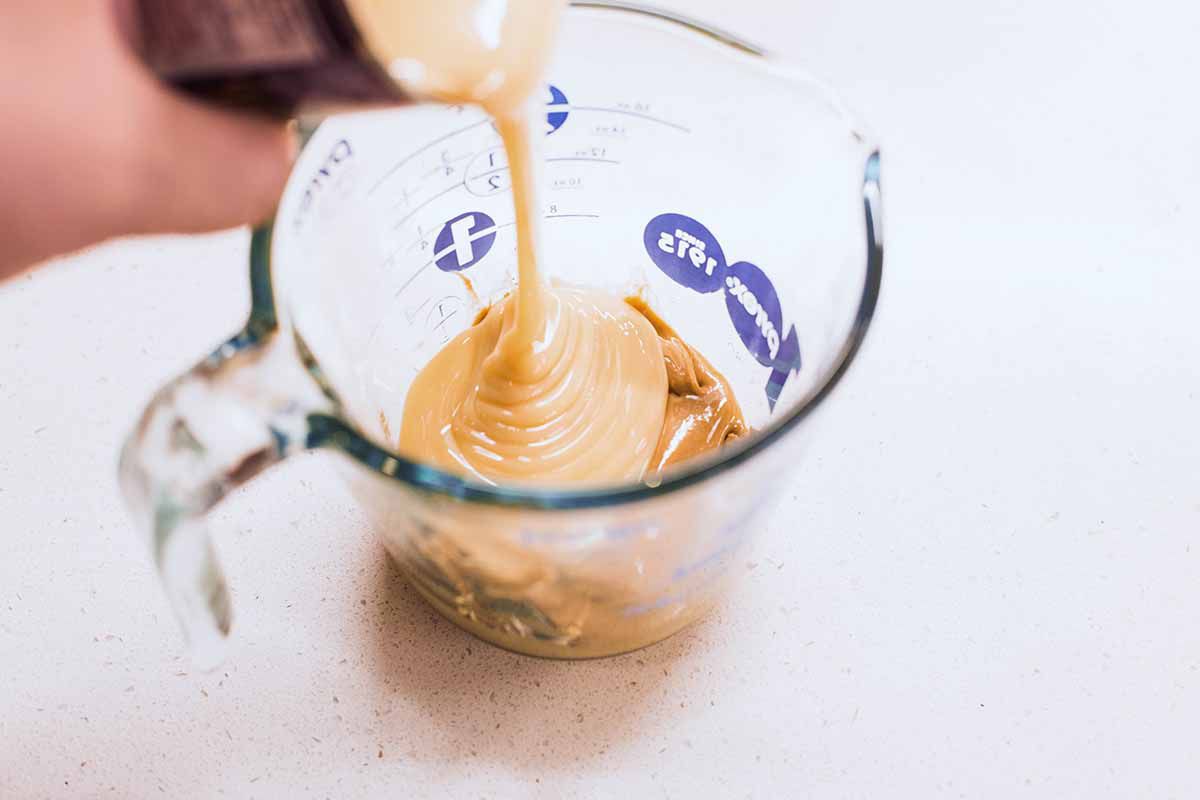 Seven Layer Bars with Peanut Butter and Pretzels add the milk