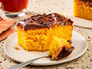slice of Brazilian Carrot Cake on a plate with a fork