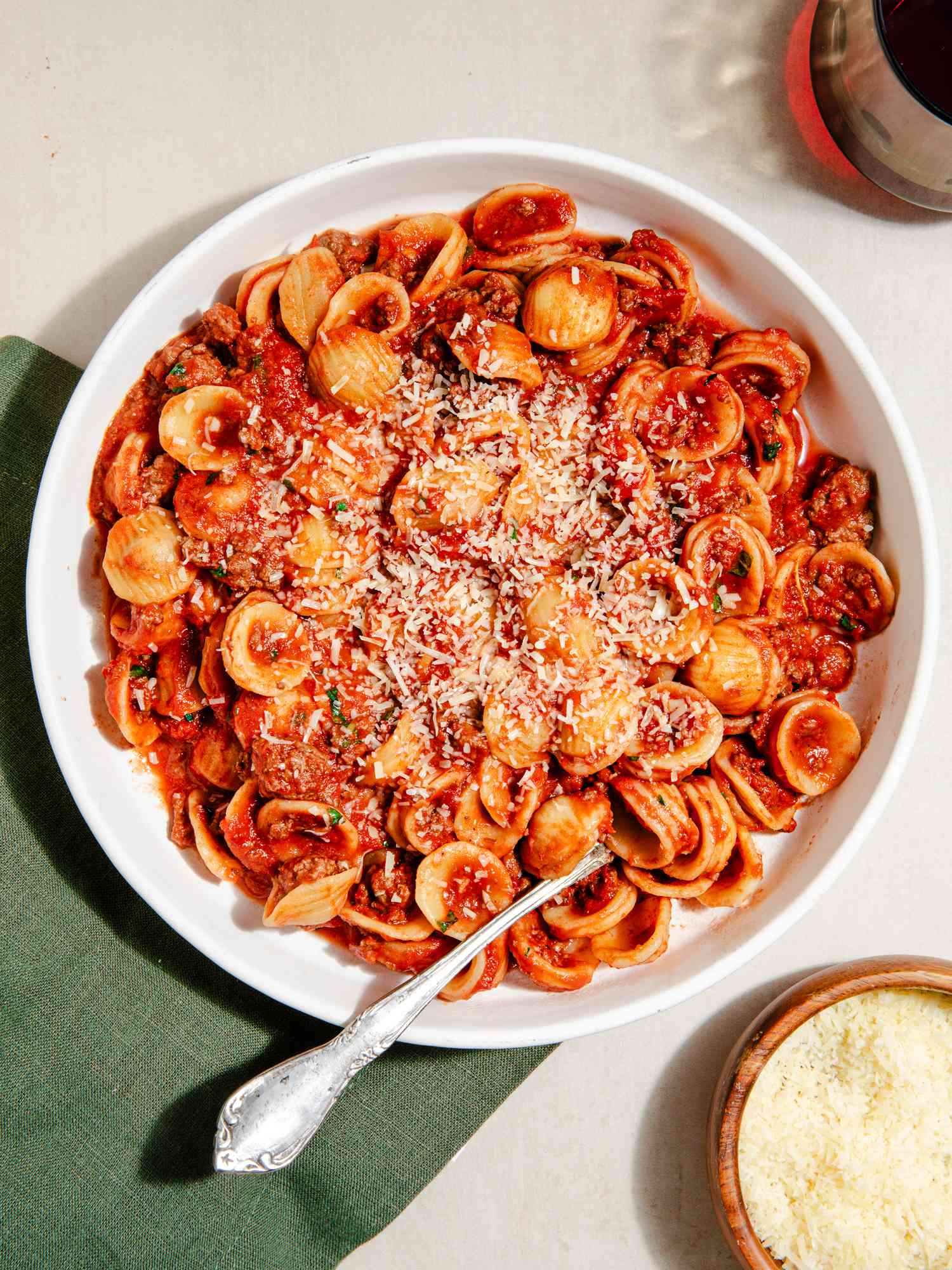 Bowl of Ina Garten's Bolognese at a table setting